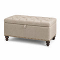 Cassapanca in tessuto beige con gambe in legno